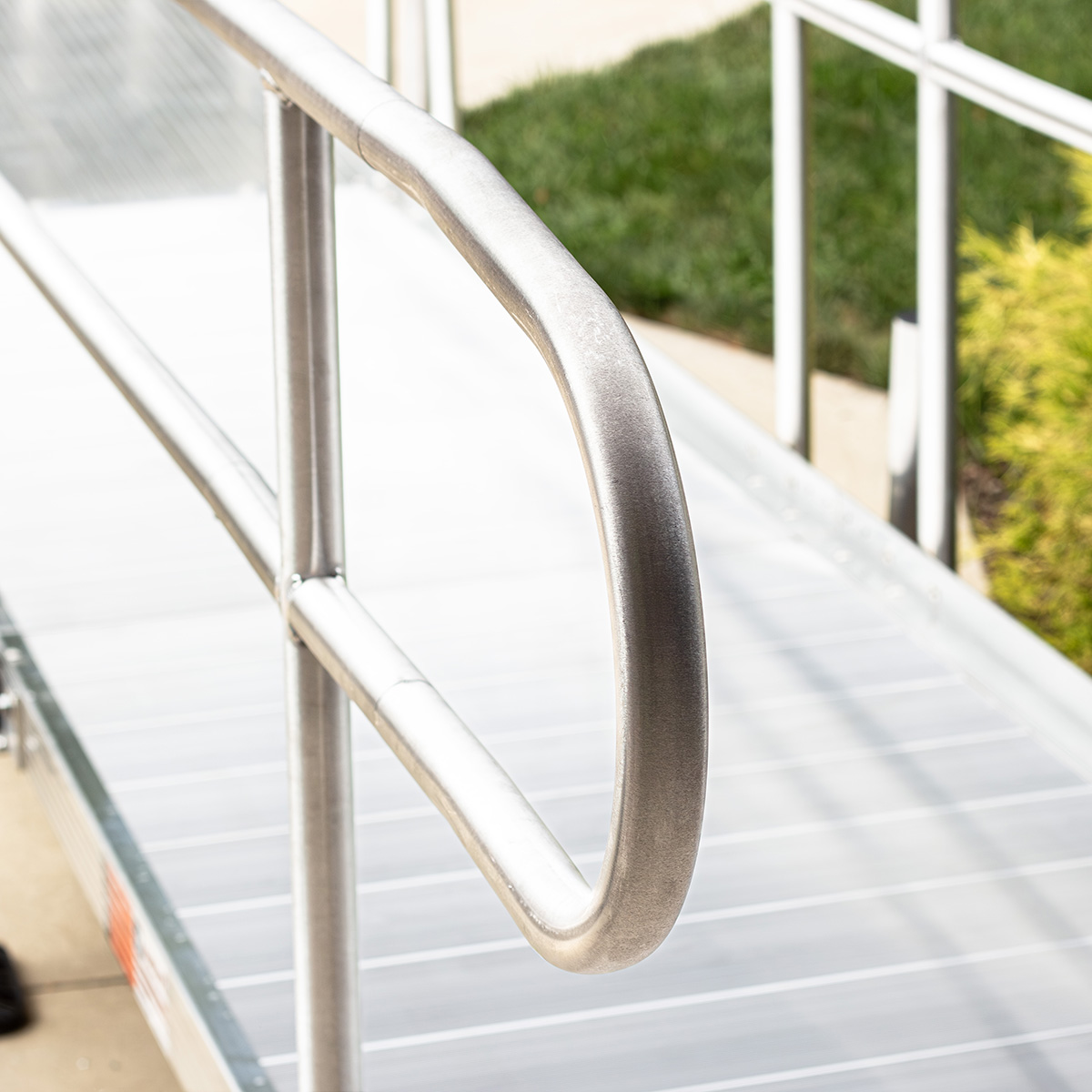 Aluminum ANSI loop at the end of a Rampit USA ramp, providing a smooth, continuous gripping surface.