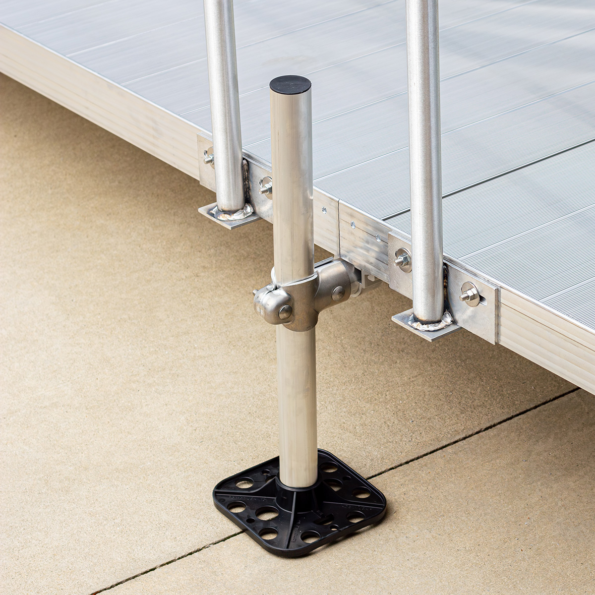 Detailed view of Rampit USA residential ramp support assembly, handrail posts, leg, and post cap.
