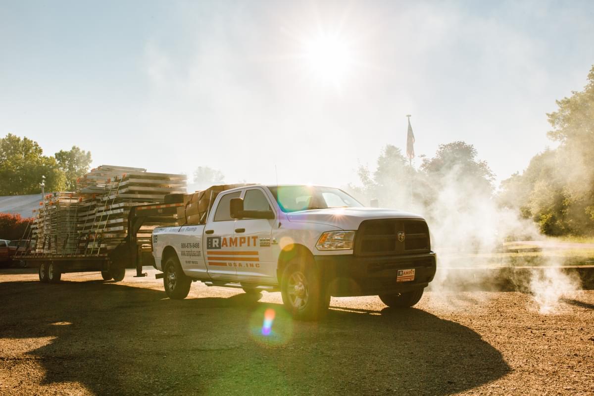 Rampit USA truck delivers wheelchair-accessible ramps to a customer installation site.